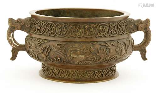 A Chinese bronze incense burner, moulded with dragon chasing a flaming pearl with other mythical ...