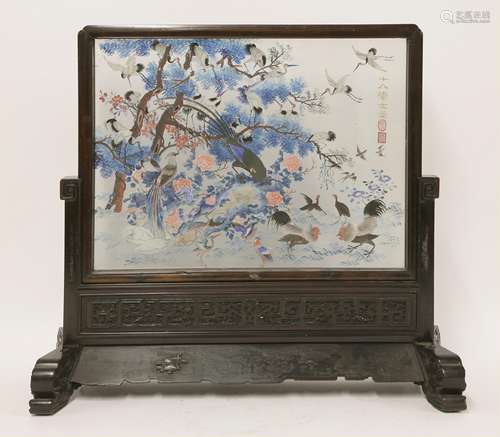 A Chinese table screen, early 20th century, carved with stylised chilong confronting a bat, all ...