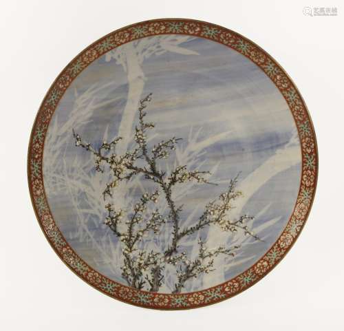 A Japanese Arita charger, Meiji period (1868-1912), painted with a blossoming prunus tree with ...
