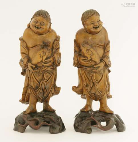 A pair of Chinese boxwood figures, early 20th century, each of Liu Hai, pierced and carved, the ...