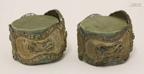 A pair of Chinese silver hinged bangles,  19th century, each with two butterflies and two dragons ...