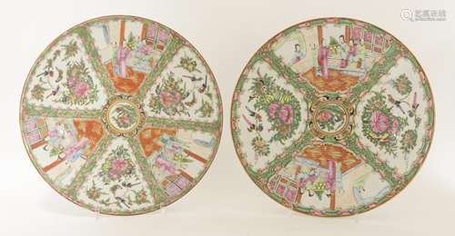 A pair of Chinese Canton famille rose plates, 19th century, enamelled with figures, birds and ...