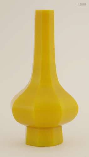 A Chinese monochrome Peking glass vase, of octagonal form with elongated straight neck in mango ...