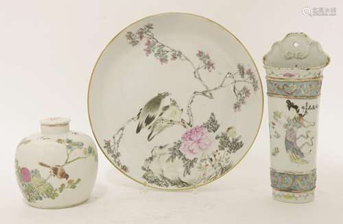 A Chinese famille rose plate, Guangxu (1875-1908), painted with a pair of bulbul on a blossoming ...