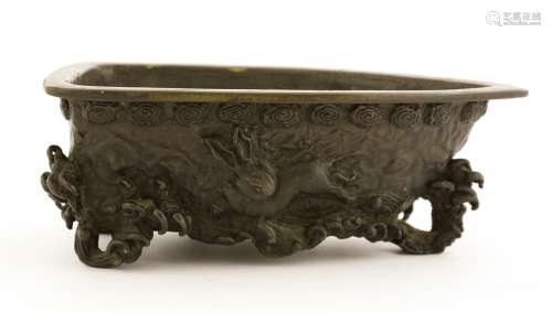 A Japanese bronze censer, Meiji period (1868-1912), in a boat shape, cast with a dragon above ...