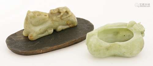 A jade carving, with a monkey on the back of a recumbent horse, 8cm, associated wood stand, and an ...