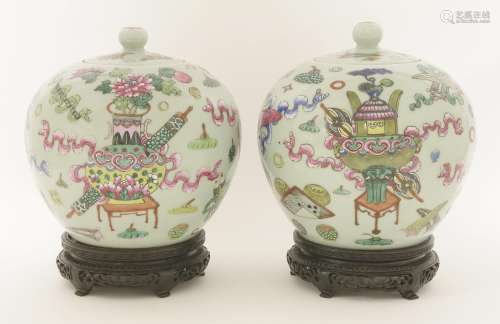A pair of Chinese famille rose vases and covers,  late Qing dynasty, each of globular form, painted ...