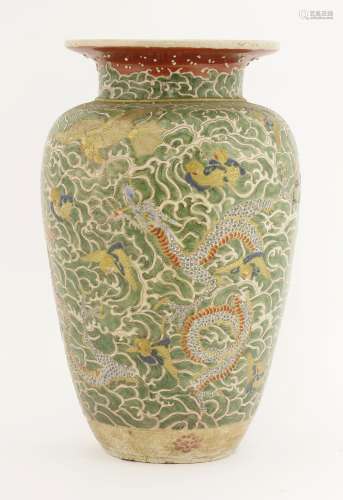 A Japanese vase, Meiji (1868-1912), decorated with mythical beasts amongst green spuming waves, the ...