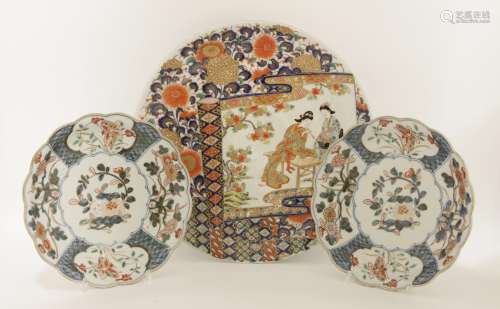 A pair of Japanese Arita plates, possibly 18th century, of lobed circular form, painted with ...