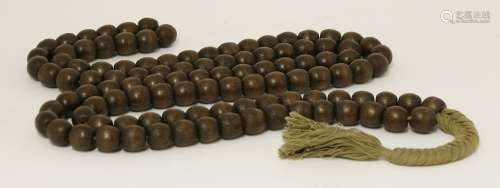 A string of Chinese wooden beads, of aloes wood, each of the 108 beads in rounded form, connected ...