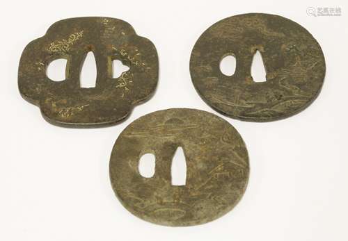 Three Japanese iron tsuba, Meiji period (1868-1912), two with figures by a river in a landscape, ...