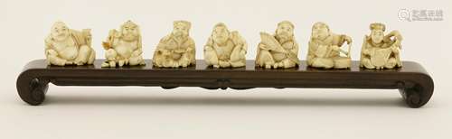 A set of Japanese ivory carvings, Meiji (1868-1912), of the Seven Gods of Fortune, each holding ...