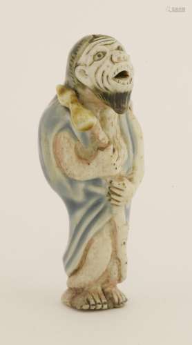 An unusual Japanese porcelain netsuke, 19th century, probably from Hirado, of a Daoist immortal ...