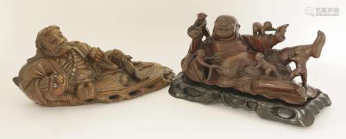 Two Chinese wood carvings, early 20th century, one of Budai resting on his side surrounded by five ...