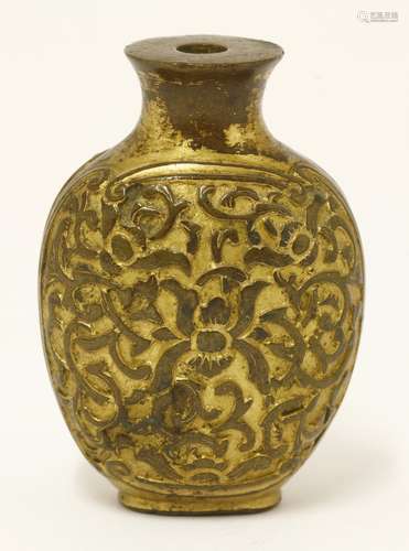 A Chinese gilt bronze snuff bottle, with scrolling lotus in shaped panels, 5.5cm