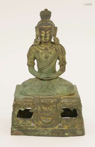 A bronze bodhisattva, Qianlong (1736-1795), seated cross-legged on a pierced high pedestal with ...
