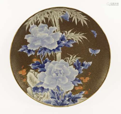A Japanese charger, Meiji period (1868-1912), painted with butterflies flying amongst peony and ...