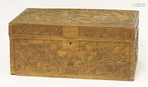 A Chinese wooden hinged box and cover, 19th century, the cover carved with a dragon amongst clouds, ...