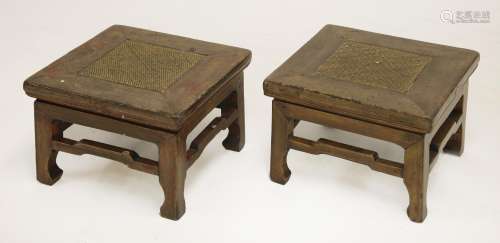 A pair of Chinese elm stools, late 19th century, each of square form with humpback stretchers on ...