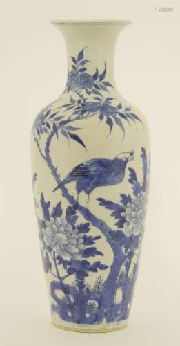 A Chinese blue and white vase, Guangxu (1875-1908), painted with a bird standing on a peach blossom ...