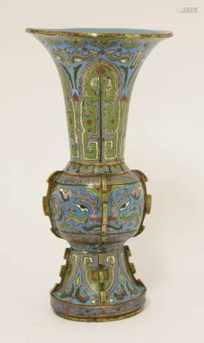 A Chinese cloisonné gu vase,  18th century, with taotie masks and stylised chilong between key fret ...