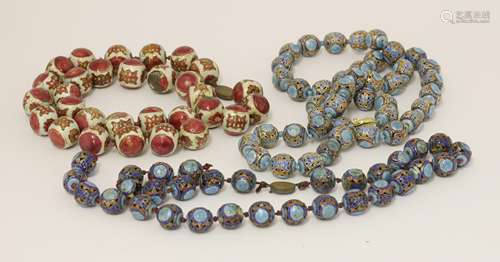 Three Chinese cloisonné bead necklaces, c.1930, enamelled with shou characters against blue or red ...