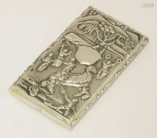 A Chinese silver card case, late 19th century, the front depicting a New Year festival with people ...