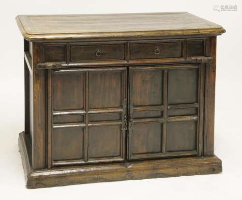 A Chinese elm cabinet,  19th century, of rectangular form with two drawers above two doors, 87cm ...