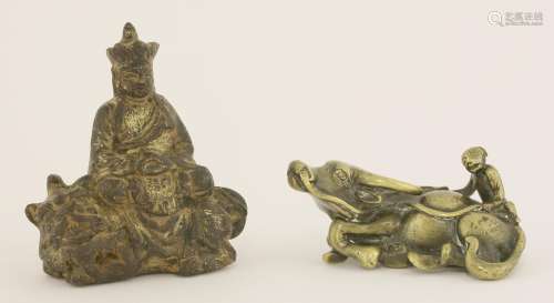 A Chinese bronze bodhisattva,  Qing dynasty (1644-1911), seated cross-legged on the back of a ...