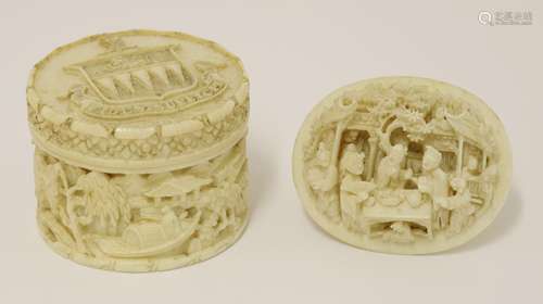 A Chinese ivory circular box and cover, late Qing dyansty, the cover carved with a family crest ...