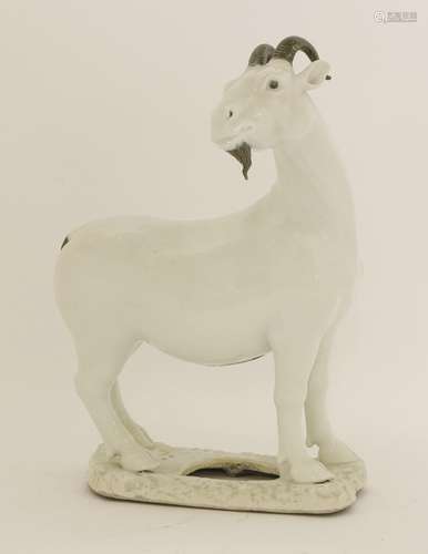 A Chinese porcelain figure, Republic period (1912-1949), modelled as a goat with his head turned to ...