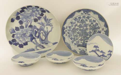 A Japanese blue and white plate, 19th century, in the Nabeshima style, painted with peony by rocks, ...