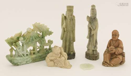 A collection of Chinese carvings, 20th century, including a jade carving of a junk boat above wave, ...