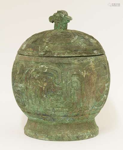 A Chinese bronze jar and cover, moulded with stylised phoenixes against key fret ground, the cover ...