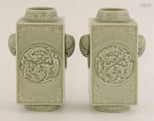 A pair of Chinese celadon Cong vases, of rectangular shape, moulded with roundels of three chilong, ...