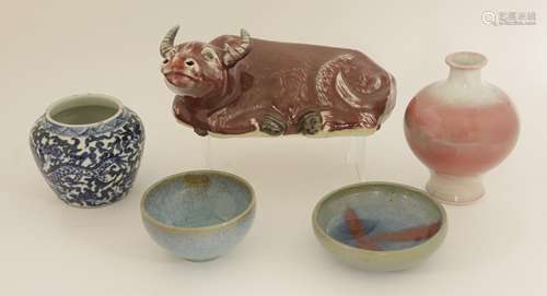 A collection of Chinese and Japanese ceramics, including a jun type bowl and a saucer, a blue and ...