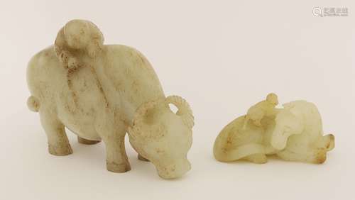 A Chinese jade carving, 20th century, with a boy on the back of a buffalo, 17.5cm, and another ...