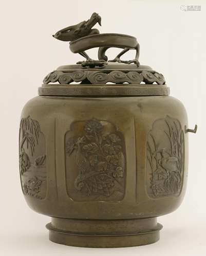 A Japanese bronze koro and cover, Meiji period, in lobed circular form, with panels of birds such ...