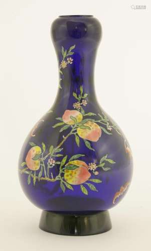 A Chinese Peking glass vase, the blue pear-shaped body with garlic mouth on a circular foot, ...