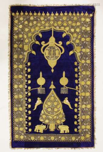 An Indo-Persian wall hanging, early 20th century, the purple velvet worked in gold thread with a ...