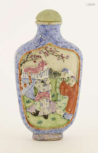 A Chinese famille rose snuff bottle, early 20th century, with moulded figures in an interior ...