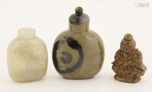 Two Chinese agate snuff bottles, one carved with two literati seated by a cliff under a pine tree, ...