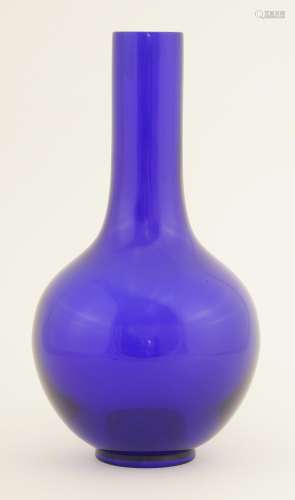 A Chinese monochrome Peking glass vase, the cobalt blue globular body with a long straight neck, ...