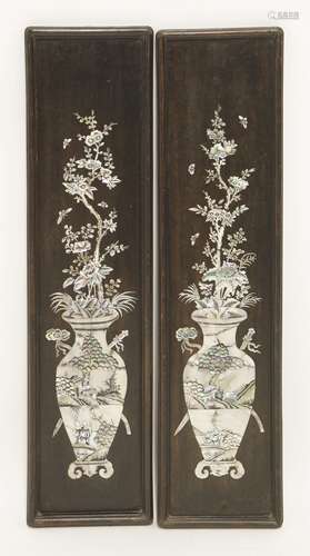 A pair of wood hanging panels, early 20th century, onlaid in mother of pearl with two vases ...