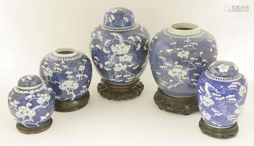 A collection of Chinese blue and whire ginger jars, c.1900 or later painted with blossoming prunus ...