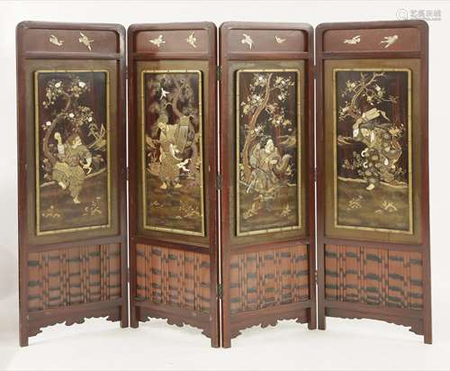 A good four-fold screen, c.1870, in lacquer and Shibayama, each panel depicting a deity, including ...