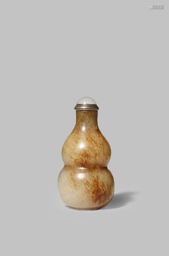 A CHINESE CELADON JADE SNUFF BOTTLE QING DYNASTY Carved as a double gourd with a tall neck, the