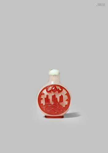 A CHINESE RED-OVERLAY GLASS SNUFF BOTTLE 19TH CENTURY With a flattened circular body carved