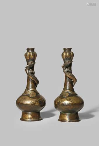 A PAIR OF CHINESE PARCEL-GILT BRONZE VASES LATE MING DYNASTY The bulbous bodies supported on tall
