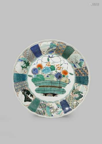 A CHINESE FAMILLE VERTE MOULDED DISH KANGXI 1662-1722 The centre decorated with a flower basket, the
